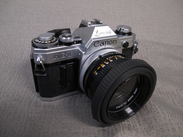 Canon AE-1 35mm Camera with 50mm f1.8 FD Lens – Phototek Canada